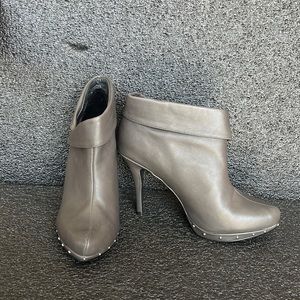 Maurice’s size 8 grey heeled booties with studs.